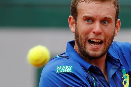 Tennis - French Open - Roland Garros - Mathias Bourgue of France v Andy Murray of Britain - Paris, France - 25/05/16. Mathias Bourgue of France eyes the ball. REUTERS/Gonzalo Fuentes