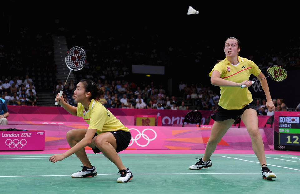 LONDON, ENGLAND - JULY 29: Alex Bruce (R) and Michele Li (L) of Canada return a shot against Ha Na Kim and Kyung Eun Jung of Korea during their Women's Doubles Badminton on Day 2 of the London 2012 Olympic Games at Wembley Arena on July 29, 2012 in London, England. (Photo by Michael Regan/Getty Images)