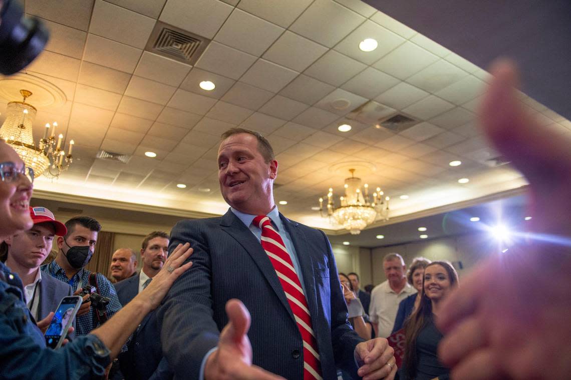 Missouri Attorney General Eric Schmitt greats a crowd of supporters in St. Louis after winning the GOP primary for U.S. Senate on Tuesday, Aug. 2, 2022