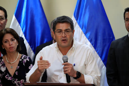 Honduras President and National Party candidate Juan Orlando Hernandez addresses the media at the Presidential House in Tegucigalpa, Honduras December 6, 2017. REUTERS/Jorge Cabrera