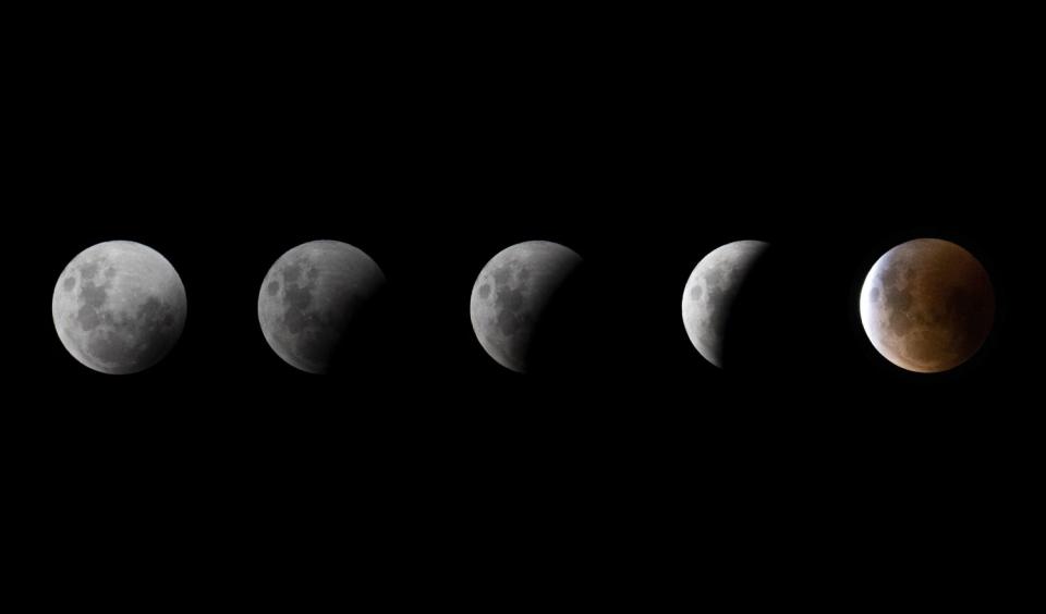 This combination of pictures shows the the Blood Moon during a total lunar eclipse in Christchurch, New Zealand