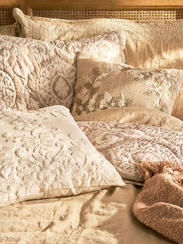<p>Pottery Barn</p> Pillows and bedding in Deepika Padukone's new line