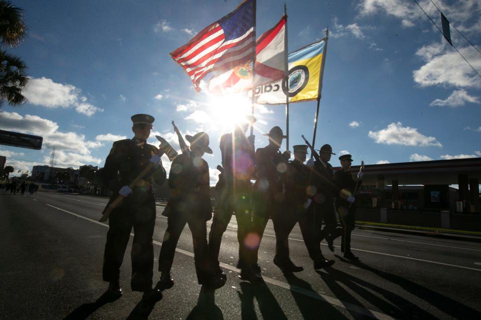 The honor guard, made up of area first responders, led the march on Monday from downtown Ocala to Webb Field.