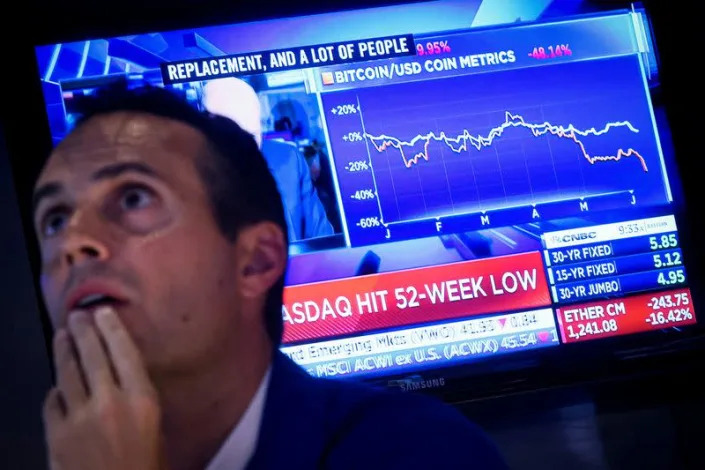 Traders work on the floor of the NYSE in New York