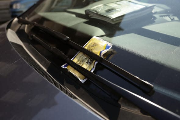 File photo dated 01/08/13 of a parking ticket on a car windscreen as councils dished out parking fines at the rate of one every four seconds last year, it has been revealed. PRESS ASSOCIATION Photo. Issue date: Monday April 14, 2014. Local authorities issued around 7.8 million parking penalty charge notices (PNCs) in 2013. amounting to ï¿½255 million in fines, according to research by Churchill Car Insurance. And the figures could be even higher, as Churchill's statistics relate to responses from only 187 of the 435 UK councils contacted for data under the Freedom of Information Act. See PA story TRANSPORT Parking. Photo credit should read: Yui Mok/PA Wire