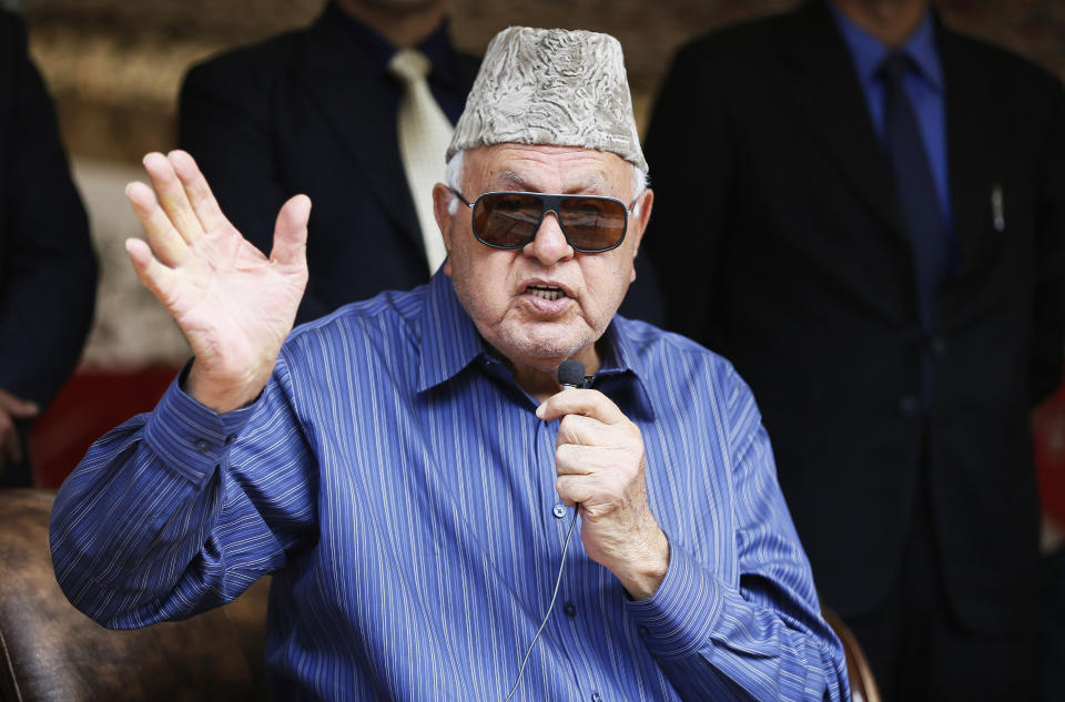 FILE - In this April 8, 2019, file photo, National Conference president Farooq Abdullah addresses his supporters during an election campaign rally in Srinagar, Indian controlled Kashmir. Abdullah, 81, also the former chief minister of Jammu and Kashmir, was arrested Monday under the Public Safety Act at his residence in Srinagar, the summer capital of the disputed region. (AP Photo/Mukhtar Khan, File)