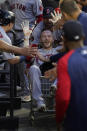 Boston Red Sox's Trevor Story celebrates in the dugout after his home run off Chicago White Sox starting pitcher Dallas Keuchel during the second inning of a baseball game Thursday, May 26, 2022, in Chicago. (AP Photo/Charles Rex Arbogast)
