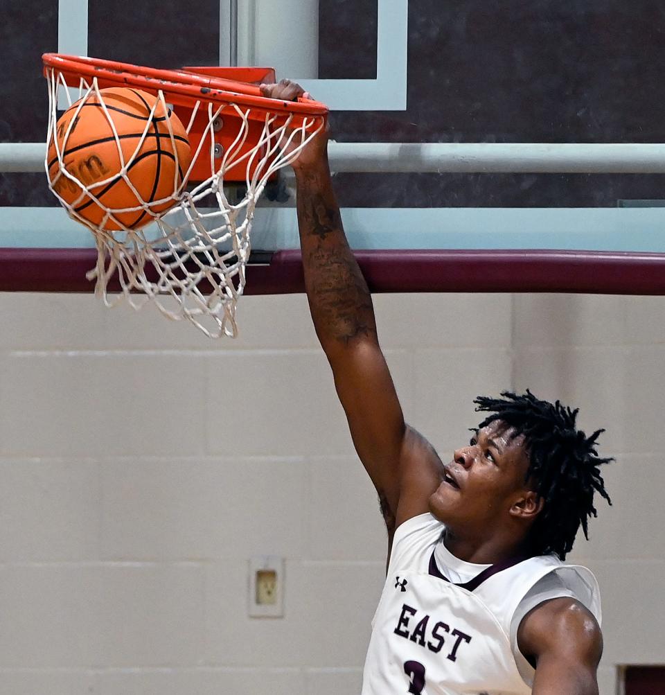 East Robertson's Elijah Groves (3) dunks the ball against White House Heritage during an high school basketball game Thursday, Feb. 8, 2024, in Cross Plains, Tenn.