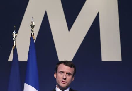 Emmanuel Macron, head of the political movement En Marche !, or Onwards !, and candidate for the 2017 French presidential election, attends a news conference to unveil his fully budgeted manifesto, named a "contract with the nation", in Paris, France, March 2, 2017. REUTERS/Christian Hartmann