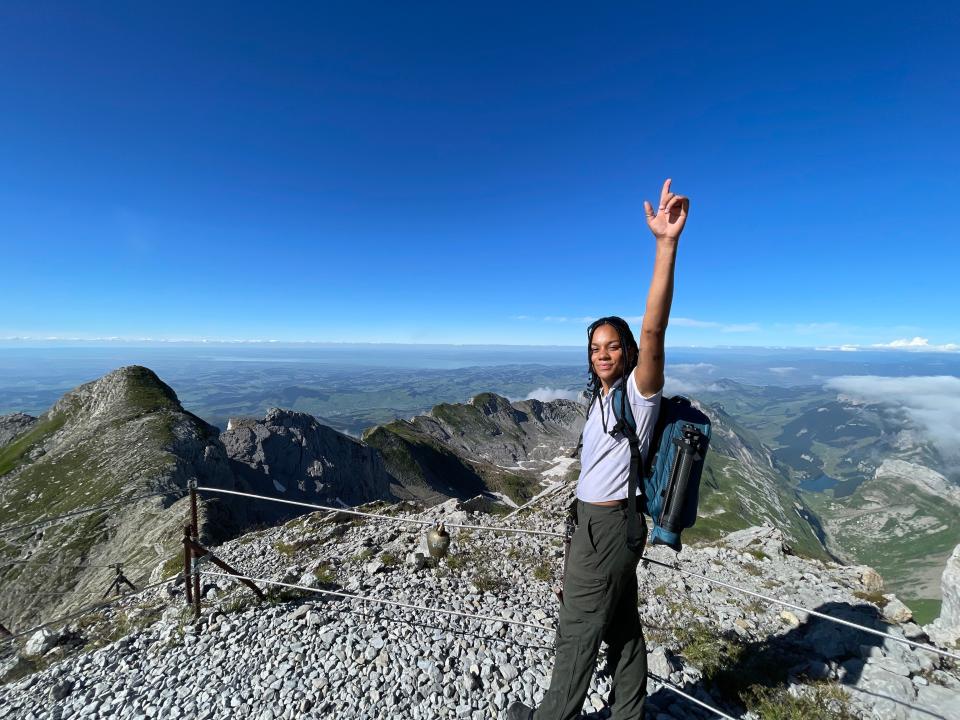 A woman at the summit of the Säntis mountain.