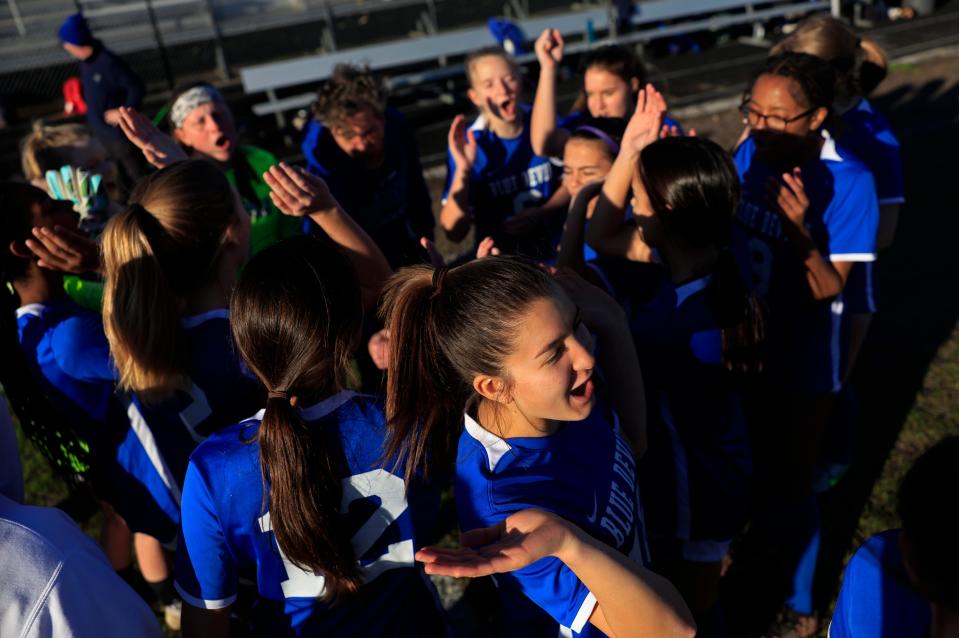 Stanton's Yuuki Wiesner (18), bottom, breaks from the huddle with her team before a first-round playoff against Alachua Santa Fe.