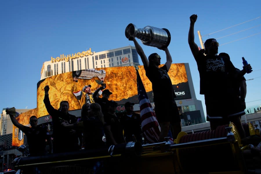 Vegas Golden Knights defenseman Nicolas Hague celebrates with the Stanley Cup during a parade along the Las Vegas Strip for the NHL hockey champions Saturday, June 17, 2023, in Las Vegas. (AP Photo/John Locher)