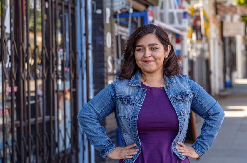 Los Angeles, CA - January 27: Portrait of entrepreneur Rosa Valdes outside Cafe Girasol on Friday, Jan. 27, 2023, in Los Angeles, CA. Valdes, 33, suffers from an anxiety disorder, which is what prompted her to design products for her Educated Chola line - jewelry, mugs, and t-shirts - that destigmatize mental health issues, especially in the Latino community. (Francine Orr / Los Angeles Times)