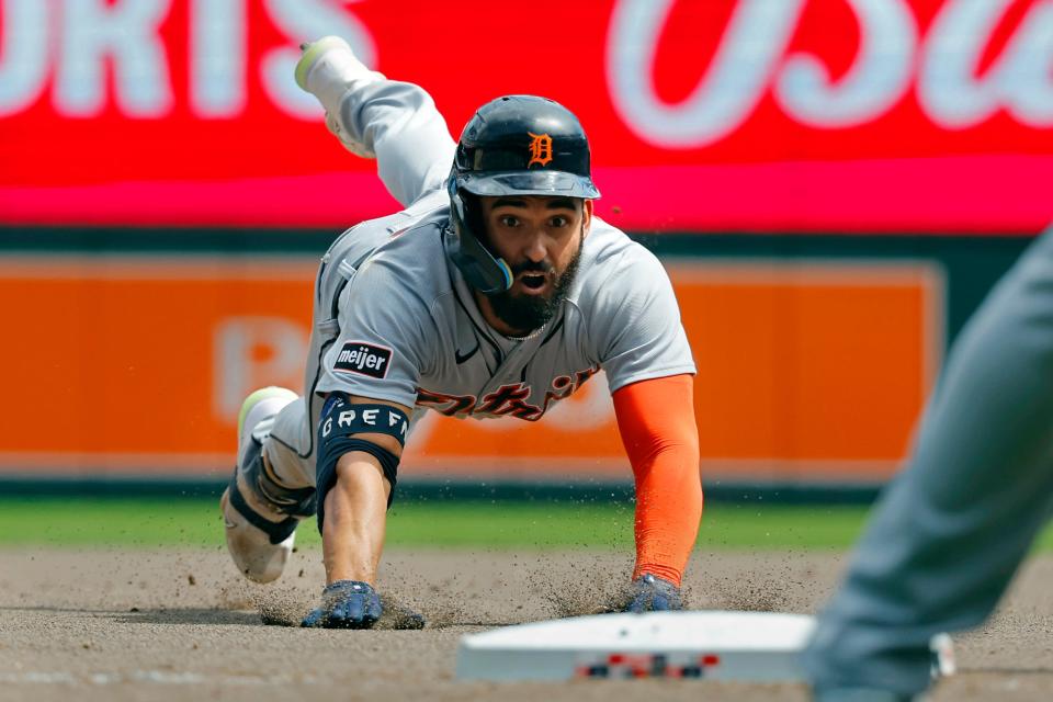 Tigers center fielder Riley Greene slides into third base for an RBI triple against the Twins in the seventh inning on Wednesday, Aug. 16, 2023, in Minneapolis.