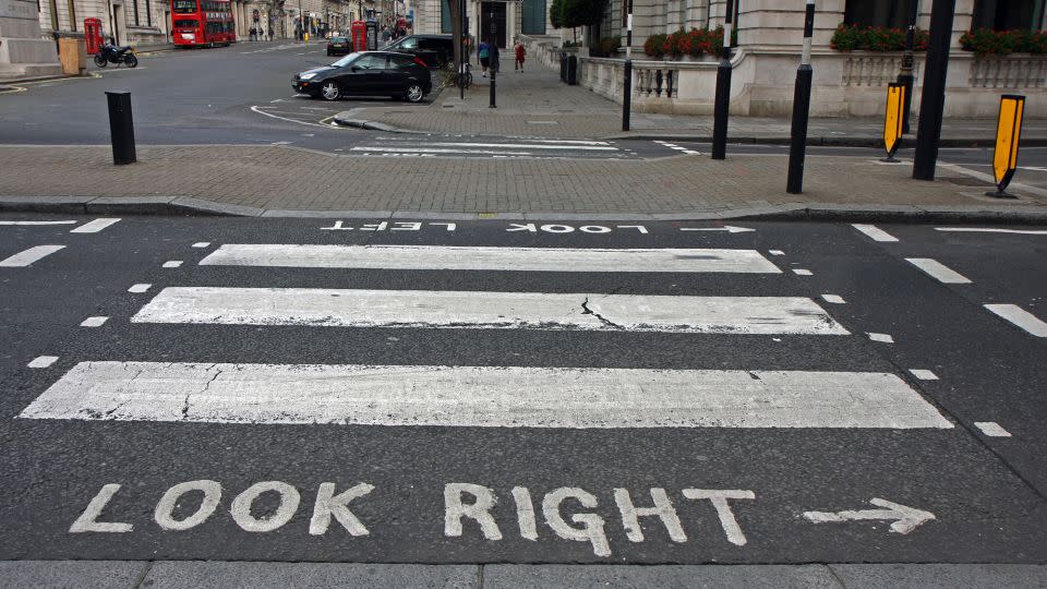 Pedestrian crossings in London, England, in September 2009. People visiting from other countries might have to remember to look for traffic coming from the opposite direction than they're accustomed to. Avis gives out bracelets to remind car renters which side to take. - Yevgenia Gorbulsky/Alamy Stock Photo