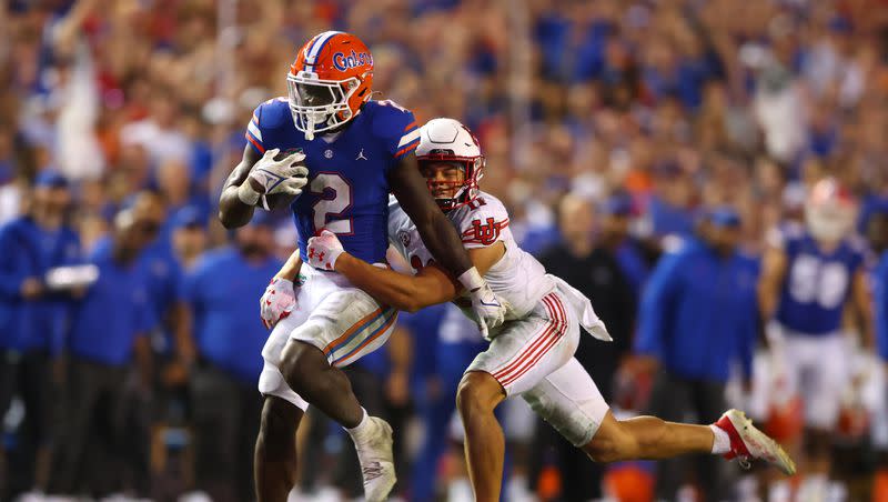 Florida Gators running back Montrell Johnson Jr. (2) is tackled by Utah Utes safety R.J. Hubert (11) as Utah and Florida play in Gainesville, Fla., on Saturday, Sept. 3, 2022. Florida won 29-26.