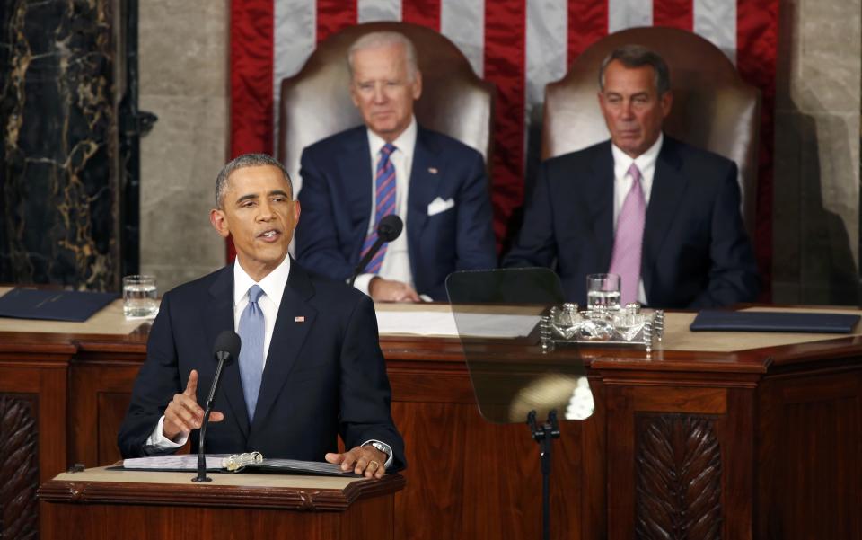 U.S. Vice President Biden and Speaker of the House Boehner watch as U.S. President Obama delivers his State of the Union address to a joint session of the U.S. Congress on Capitol Hill in Washington