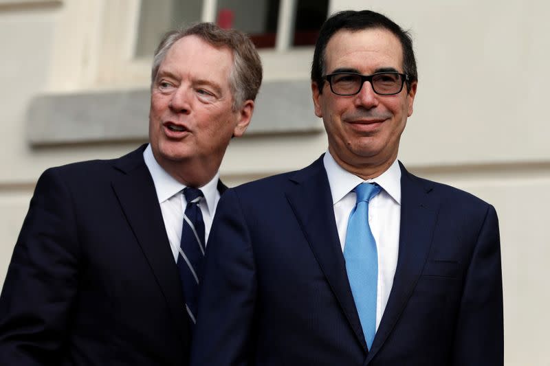 FILE PHOTO: U.S. Treasury Secretary Steve Mnuchin greets China's Vice Premier Liu He