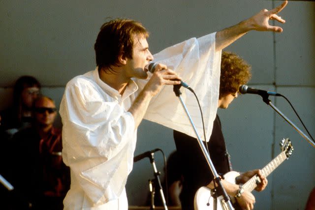 <p>Michael Putland/Getty</p> Steve Harley and Cockney Rebel performing at Crystal Palace Bowl in London on June 7, 1975