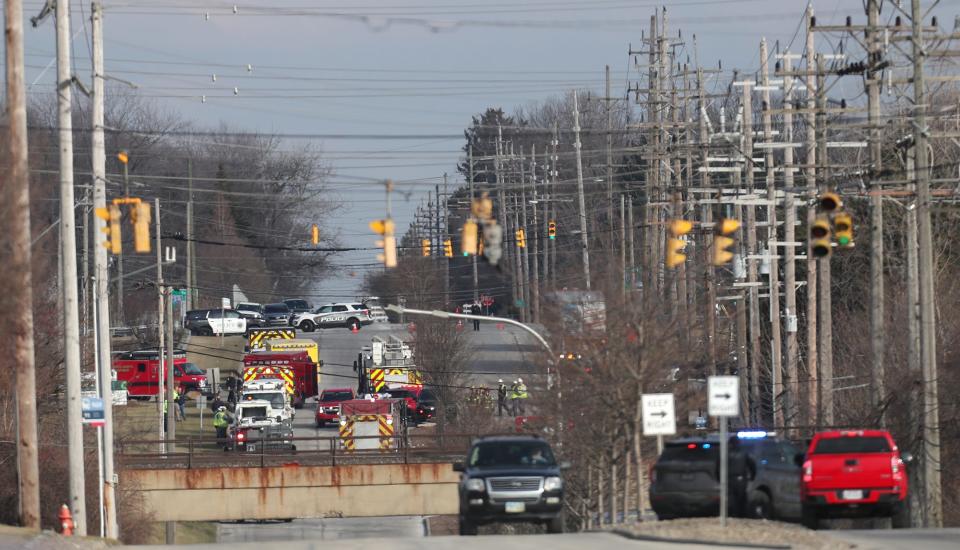 Emergency vehicles line Alexander Road as they respond to a fire and explosion at I. Schumann & Co. in Oakwood on Monday.