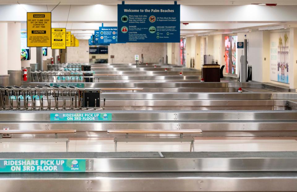 Empty baggage claim at Palm Beach International Airport in West Palm Beach, Florida on January 11, 2023. Thousands of flight delays and cancellations rippled across the U.S. after computer outage led to a grounding order by the Federal Aviation Administration. 