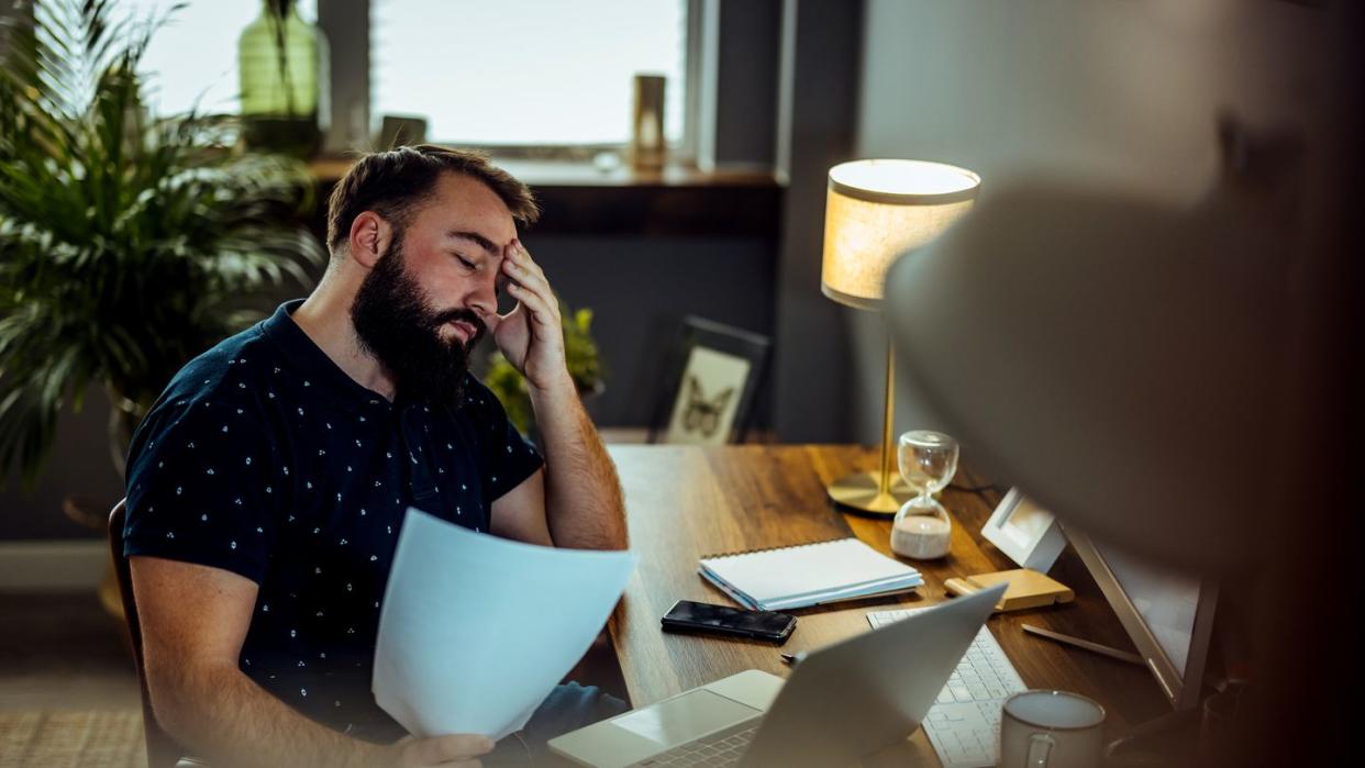 tire man paying bills and banking online