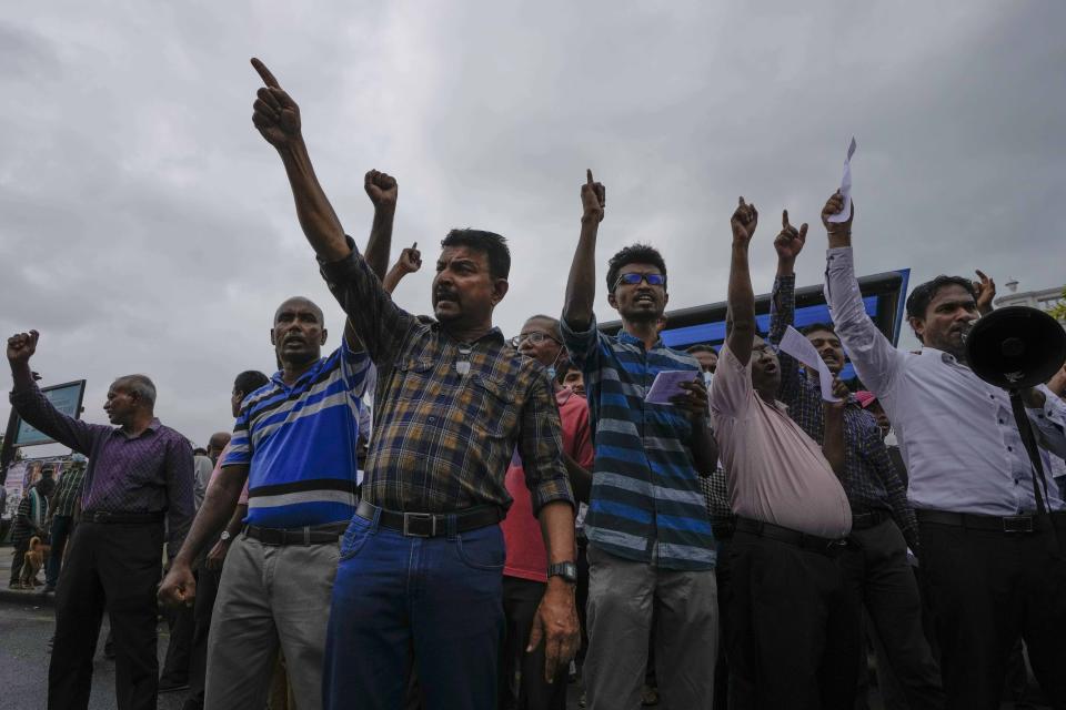 Protesters shout anti-government slogans during a protest against military eviction of protesters from the president's office in Colombo, Sri Lanka, Friday, July 22, 2022. (AP Photo/Eranga Jayawardena)