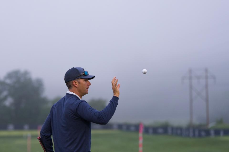 Jeremy Wells catches a ball from his caddie as he waits out a fog delay on Saturday for the PGA Championship at Valhalla. Saturday, May 18, 2024