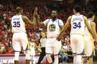 May 14, 2018; Houston, TX, USA; Golden State Warriors forward Kevin Durant (35) celebrates with forward Draymond Green (23) and guard Shaun Livingston (34) during the fourth quarter against the Houston Rockets in game one of the Western conference finals of the 2018 NBA Playoffs at Toyota Center. Mandatory Credit: Troy Taormina-USA TODAY Sports