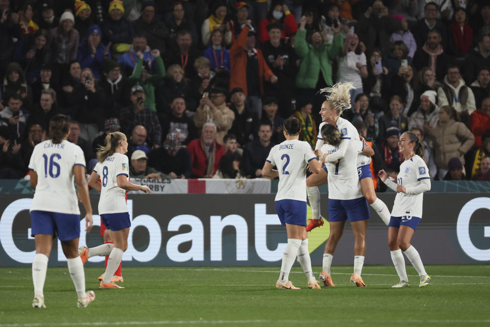 England's Lauren James, centre, celebrates with teammate after scored during the Women's World Cup Group D soccer match between China and England in Adelaide, Australia, Tuesday, Aug. 1, 2023. (AP Photo/James Elsby)