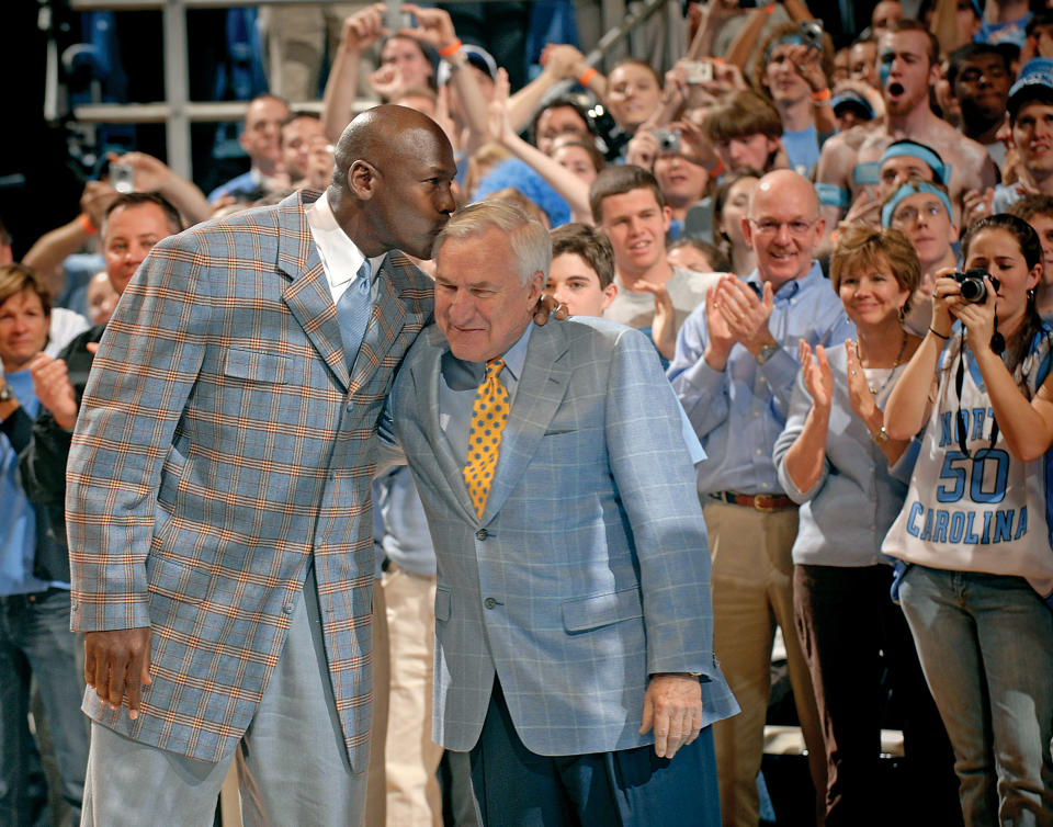 CHAPEL HILL, NC - MARCH 7:  Michael Jordan kisses former coach Dean Smith of the North Carolina Tar Heels during a halftime ceremony honoring the 1993 national championship team during a game against the Wake Forest Demon Deacons at the Dean Smith Center on March 7, 2007 in Chapel Hill, North Carolina.  (Photo by Grant Halverson/Getty Images)