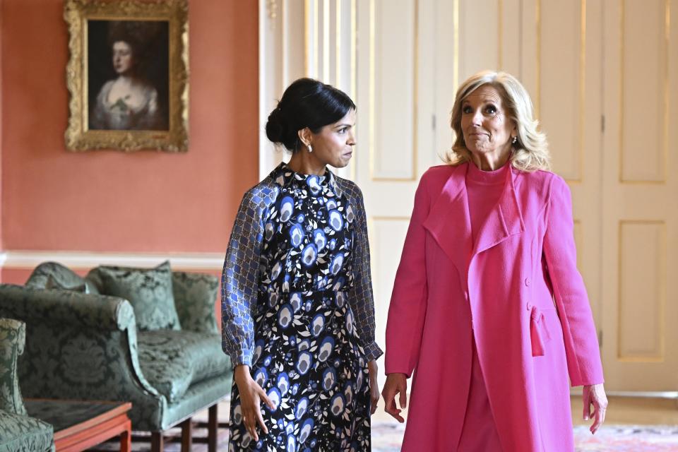 Akshata Murty, wife of Britain's Prime Minster, left, and US First Lady Jill Biden arrive for a meeting inside 10 Downing Street in central London, Friday, May 5, 2023. (Oli Scarff/Pool Photo via AP)