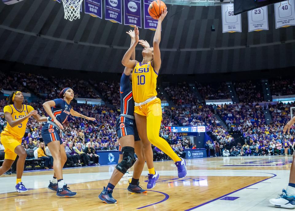 Angel Reese drives to the basket against Auburn in Sunday's big win for LSU.