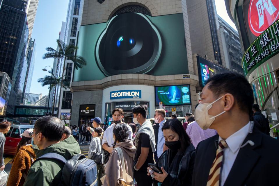 Pedestrians in Hong Kong, China, on Tuesday, Feb. 28, 2023. Photographer: Paul Yeung/Bloomberg