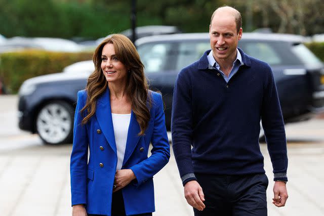 <p>SUZANNE PLUNKETT/POOL/AFP via Getty Images</p> Kate Middleton and Prince William join a mental fitness workshop on Oct. 12, 2023