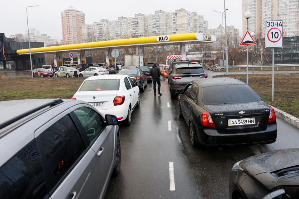 Cars queue for fuel in Kyiv.