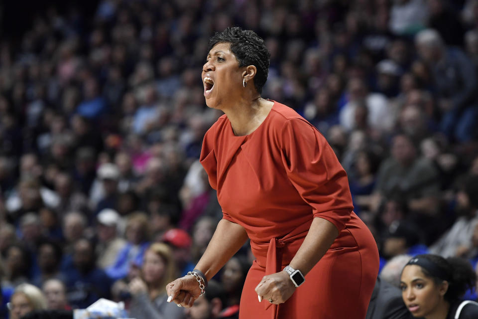 FILE - Cincinnati's Michelle Clark-Heard calls out to her team during the first half of an NCAA college basketball game in the American Athletic Conference tournament finals against Connecticut at Mohegan Sun Arena, Monday, March 9, 2020, in Uncasville, Conn. Black female representation in the coaching and sports administrative ranks has often existed on a minute scale, even in a sport like basketball, which, along with track and field, has the highest concentration of Black female college athletes. (AP Photo/Jessica Hill, File)