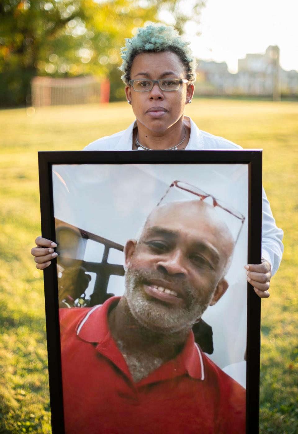 Jada McDaniel holds a portrait of her brother, Michael McDaniel, who died Feb. 6, 2021 after a violent clash with guards at the Correctional Reception Center. 