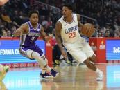 December 26, 2018; Los Angeles, CA, USA; Los Angeles Clippers guard Lou Williams (23) moves the ball against Sacramento Kings guard Yogi Ferrell (3) during the first half at Staples Center. Mandatory Credit: Gary A. Vasquez-USA TODAY Sports