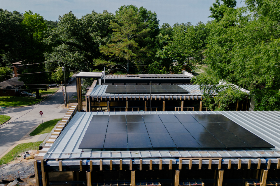 Roof-top solar panels at Tower Raleigh, a collection of three modern, net-zero-energy (NZE) homes, currently under construction at 920 Tower Street, near the Village District and Jaycee Park.