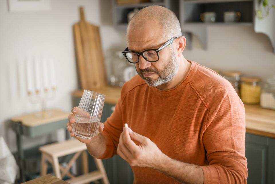 Man taking pill