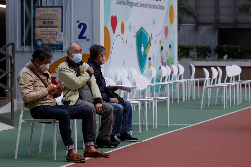 People sit at a community vaccination centre, ahead of an expected border reopening with China, during the coronavirus disease (COVID-19) pandemic in Hong Kong