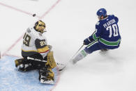 Vegas Golden Knights goalie Marc-Andre Fleury (29) makes a save on Vancouver Canucks' Tanner Pearson (70) during the third period of an NHL Western Conference Stanley Cup playoff game, Sunday, Aug. 30, 2020, in Edmonton, Alberta. (Jason Franson/The Canadian Press via AP)