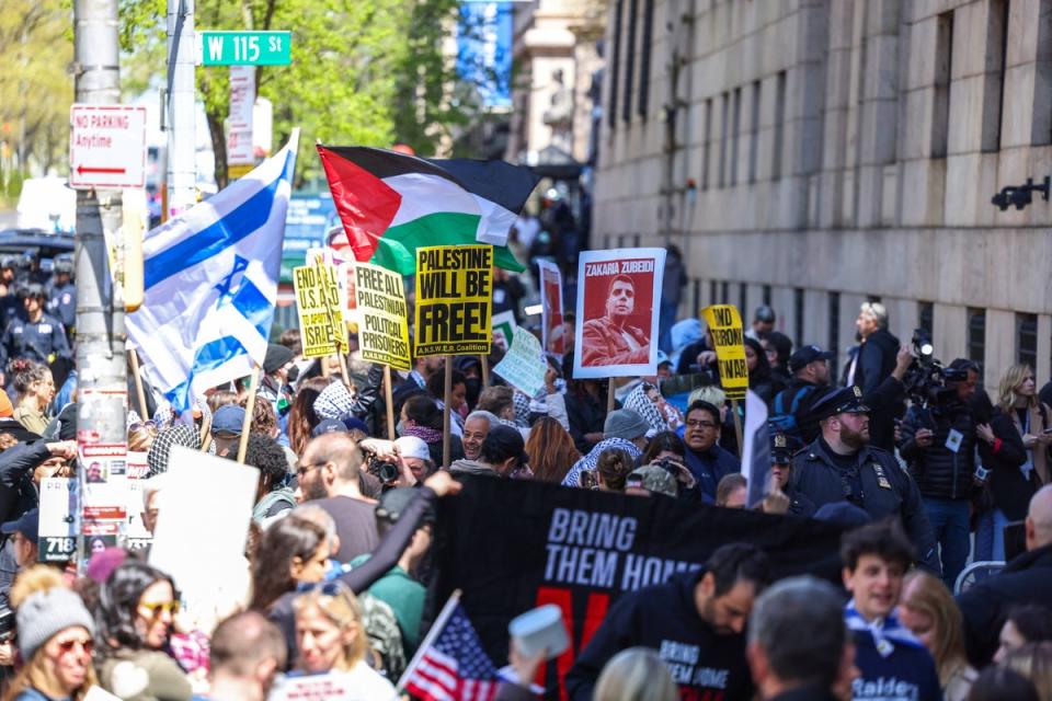 Pro-Palestinian and Pro-israel face off in front of the entrance of Columbia University which is occupied by Pro-Palestinian protesters in New York on April 22, 2024. (AFP via Getty Images)