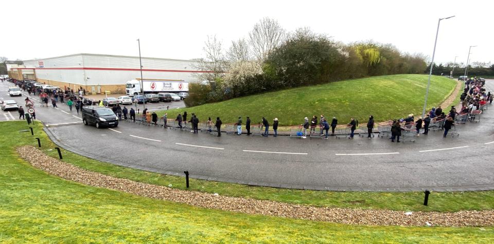 People queue outside of a Costco store in Watford, as the spread of the coronavirus disease (COVID-19) continues, Britain, March 19, 2020. REUTERS/Paul Childs