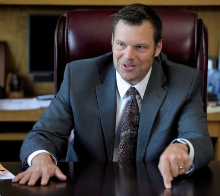 FILE PHOTO: Kansas Secretary of State Kris Kobach talks about the Kansas voter ID law that he pushed to combat what he believes to be rampant voter fraud in the United States in his office in Topeka, Kansas, U.S., on May 12, 2016. REUTERS/Dave Kaup/File Photo