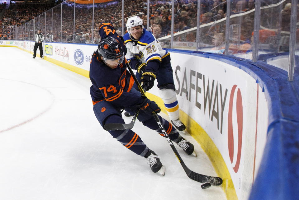 St. Louis Blues' Alexander Steen (20) and Edmonton Oilers' Ethan Bear (74) compete for the puck during the first period of an NHL hockey game Friday, Jan. 31, 2020, in Edmonton, Alberta. (Jason Franson/The Canadian Press via AP)