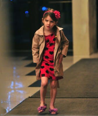 Suri Cruise, 5, wears satin purple mules in a miniature size. Photo by Wire Image.