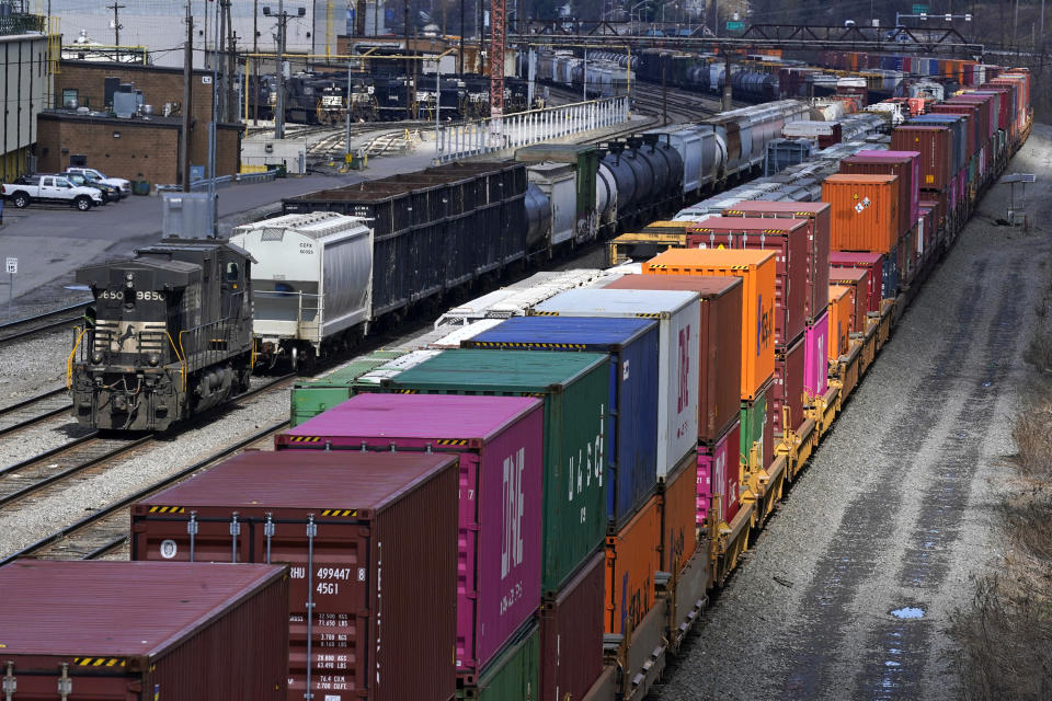 FILE - Freight train cars and containers at Norfolk Southern Railroad's Conway Yard in Conway, Pa., April 2, 2021. President Joe Biden's call for Congress to intervene in the railroad contract dispute undercuts the unions' efforts to address workers' quality of life concerns, but businesses stress that it is crucial to avoid a strike that would devastate the economy. (AP Photo/Gene J. Puskar, File)