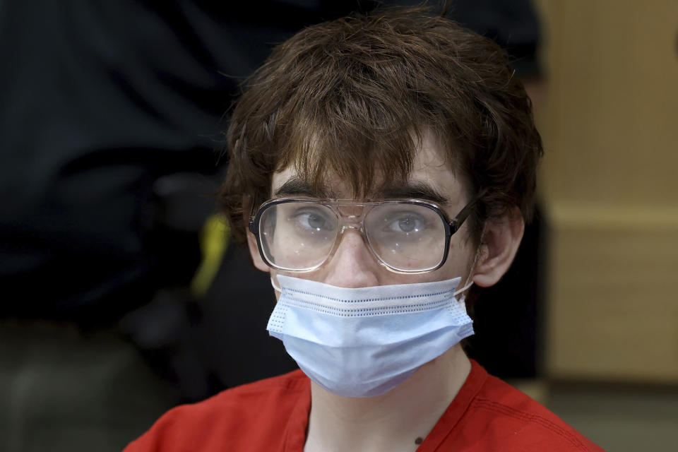 Marjory Stoneman Douglas High School shooter Nikolas Cruz is shown in court during a hearing at the Broward County Courthouse in Fort Lauderdale, Fla. on Monday, Nov. 15, 2021. Attorneys for Cruz told a judge Monday that detectives made false statements to get the search warrants allowing them to seize evidence from his cellphone and bedroom, including an argument over whether burgundy and maroon are the same color. (Amy Beth Bennett/South Florida Sun Sentinel via AP, Pool)